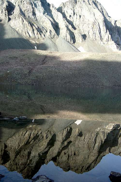 Ridge reflected in Sloan Lake in American Basin