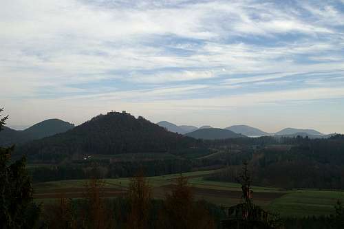 Lindelbrunn Castle and the smooth slopes of the Pfälzerwald mountains