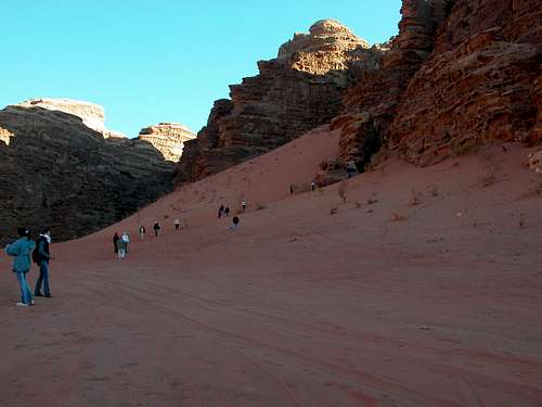 Red sand and tourists