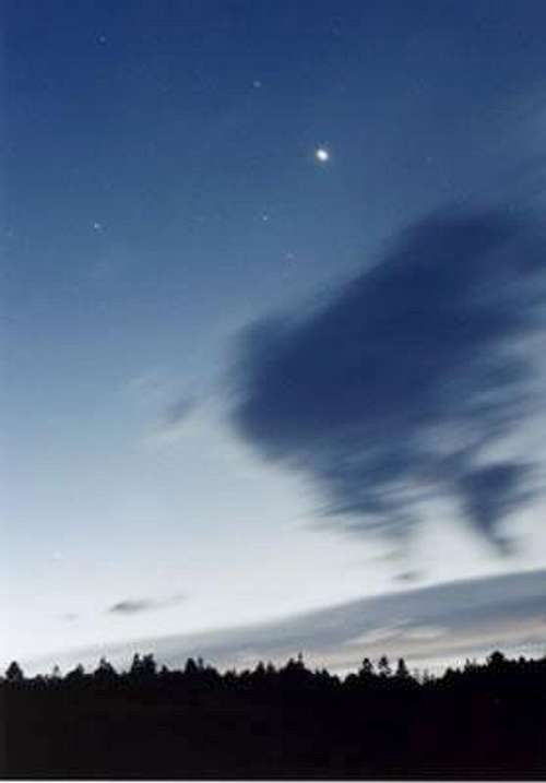 Venus and clouds above the forest