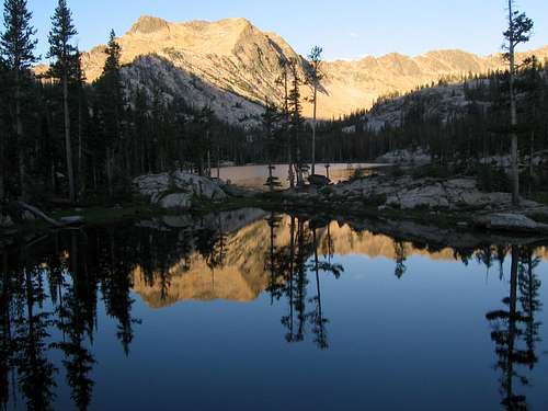 mountain mirrored in lake pool