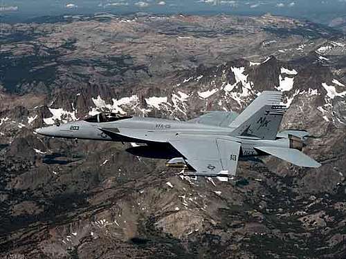 An F/A-18E Super Hornet races...