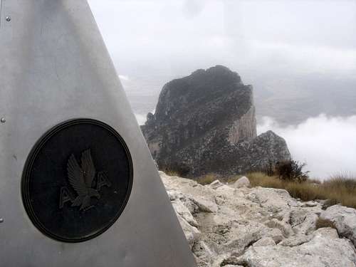 Guadalupe Summit Marker with El Capitan in background - winter