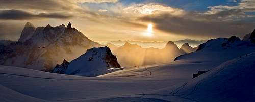 Winter sunrise over the Col du Midi (2 alpinists on RHS)