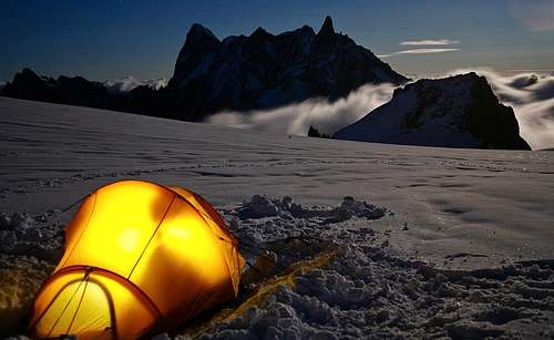 Camping under the full moon. The Grandes Jorasses silhouetted infront
