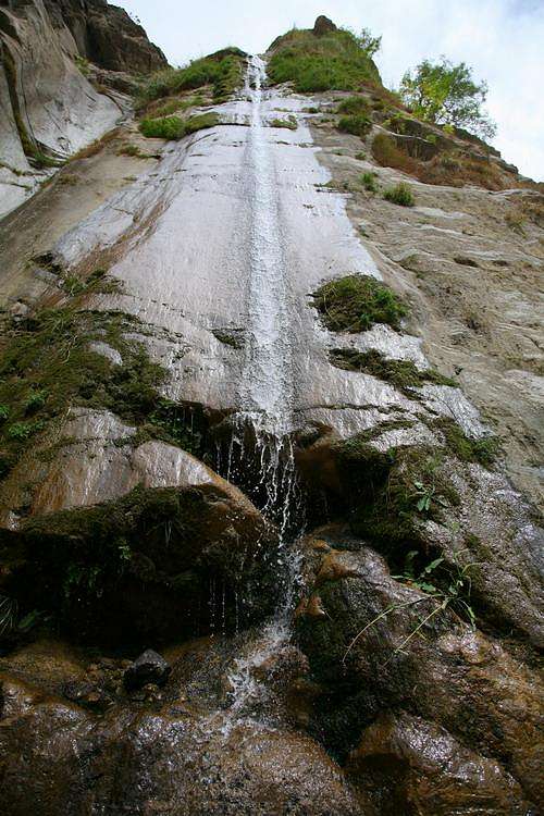 Waterfall cascades down a rock cliff along the Askole Road, Karakoram, Pakistan
