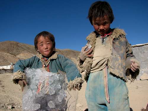 Tibetan children playing with ice...