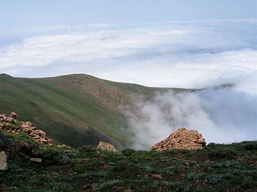 Ridgeline descending into clouds