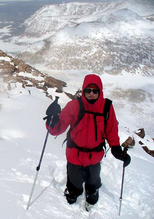 Rob on the summit ridge, with Gunsight / Gilbert behind