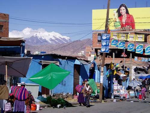 Illimani towering the markets of La Paz