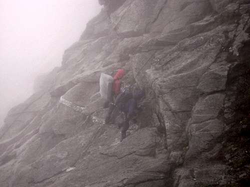 Trying to get off this stinker in the rain - SE Face descent route