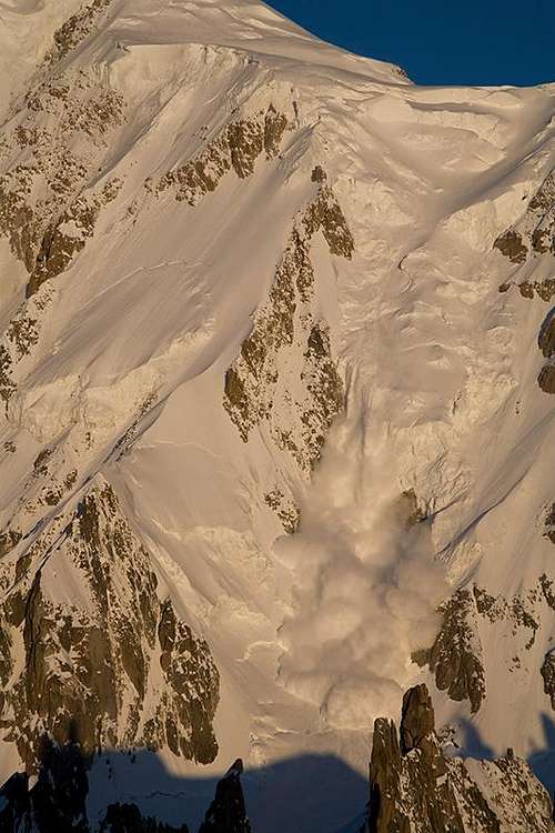 Avalanche on the Brenva face of the Mont Blanc at dawn