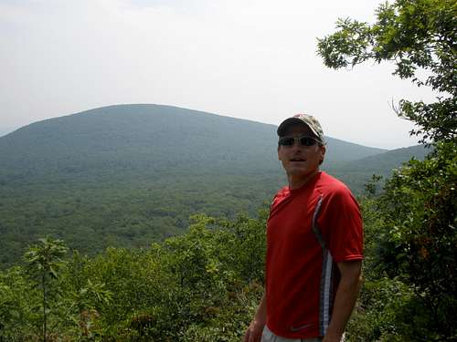 My dad with moutains (?) in the background