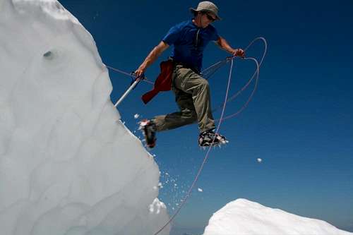 Jumping the Bergschrund just below the summit on Mt. Challenger