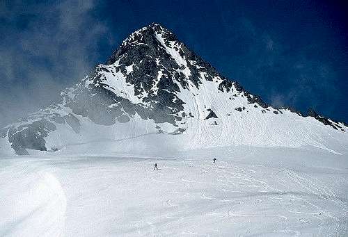Two skiers below the summit...
