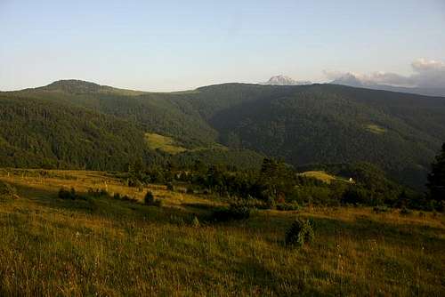 Pastures on Bjelasica with Komovi in the distant far