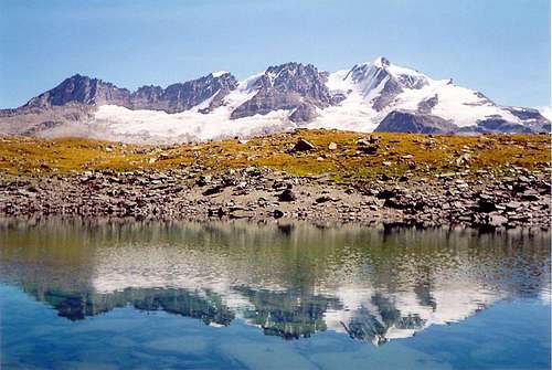 West side of Gran Paradiso chain reflected <br>into a small lake of the Vallone delle Meyes