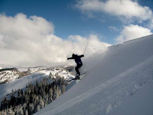 Skier drops into Dutch Draw from Silver Peak