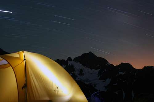 Night 5 on Ptarmigan Traverse: Star trails over Formidable and Glowing Tent at Kool-Aid Lake