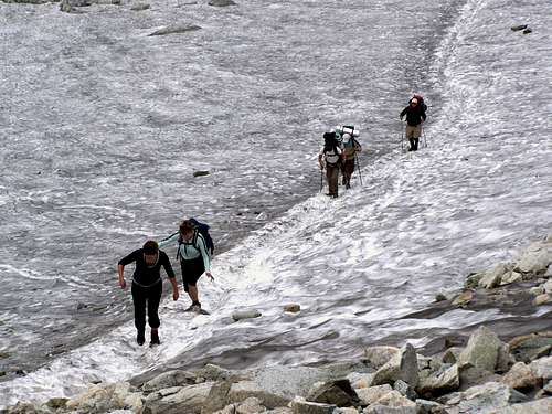 Hikers crossing a snow patch on the 1st August just after the Rysy hut