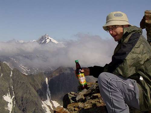My brother with the summit beer on the top of Petzeck