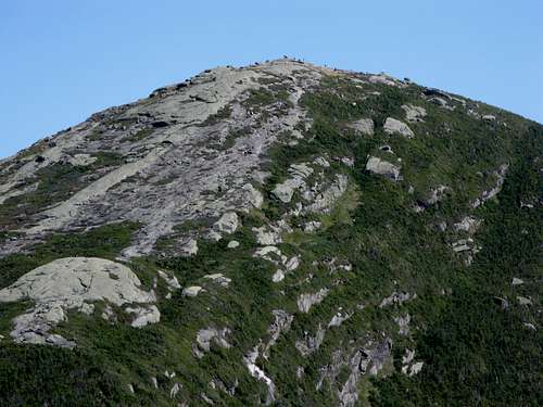 The summit block of Mt. Marcy with hikers on top