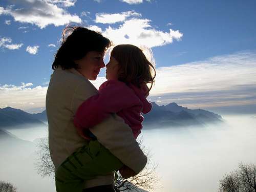 My two lovely girls above a cotton sea-clouds