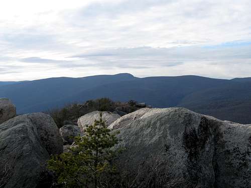 Blue ridge with boulders in foreground