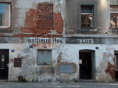 Remains of german inscriptions on a decrepited wall in the czech city of Jesenik, in the Sudetes