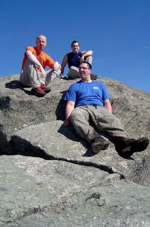 Group on summit boulder