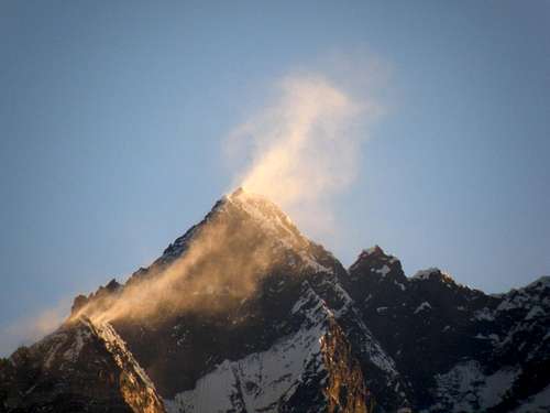 Wind & snow above Lhotse at sunrise