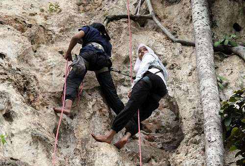 Malay girls climbing