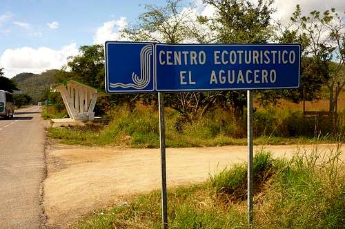 Sign to El Aguacero from the highway