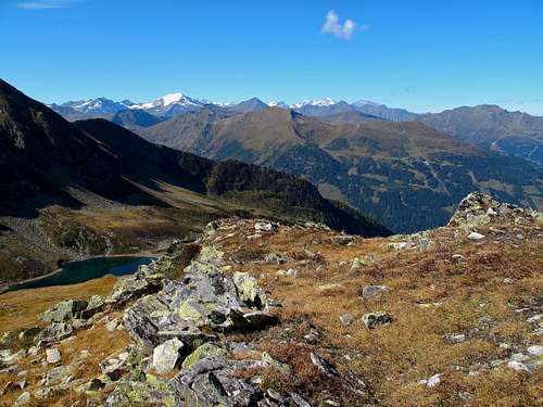 View from the Palfnerscharte saddle to the Palfnersee lake and the Goldberg and Glockner groups behind