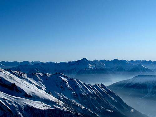 View to the carinthian Alps with haze in the valleys