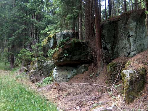 Lone rocks in Góry Stołowe, somewhere in the forest
