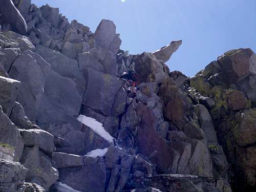 Justin downclimbing the fourth class section