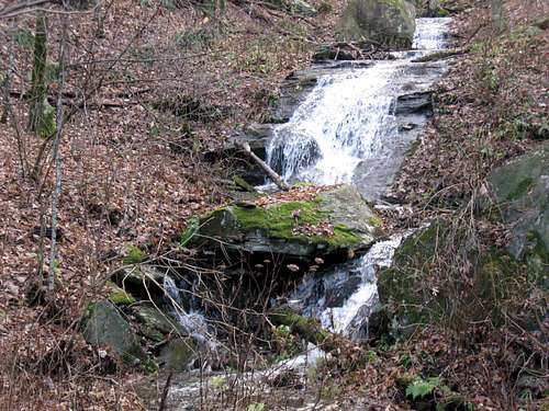 Waterfall beside trail