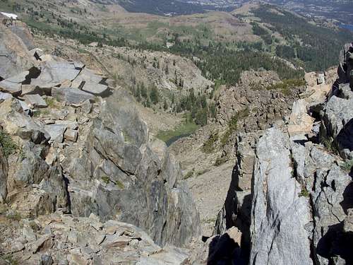 View down the steep rocks from Peak 9795