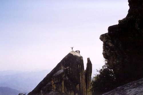 Climber atop The Monk.