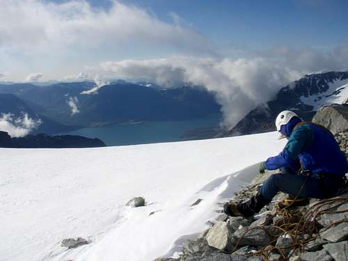 A pause before popping up to the main summit.  Great view of the fjord below.