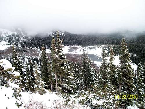 Serpent Lake peeking out below the clouds