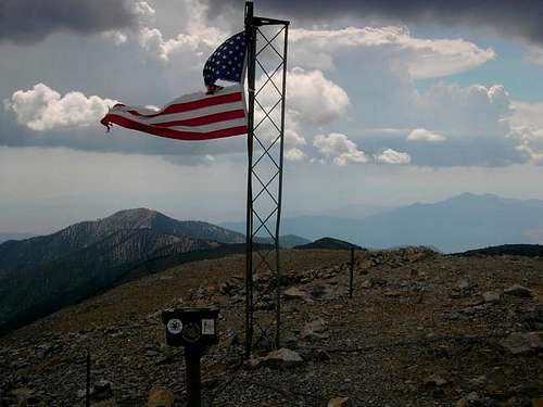 At the summit, the flag has...