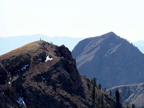a deer hunter on the sub-peak with Haystack in the background