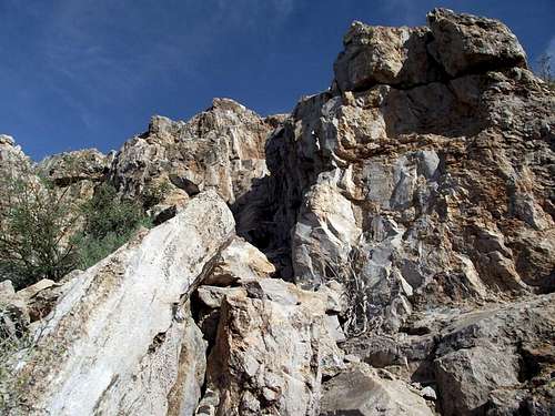 Mostly solid rock to summit