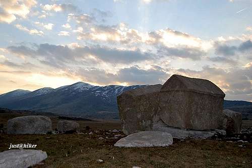 Mountain medieval tombstones under afternoon sky