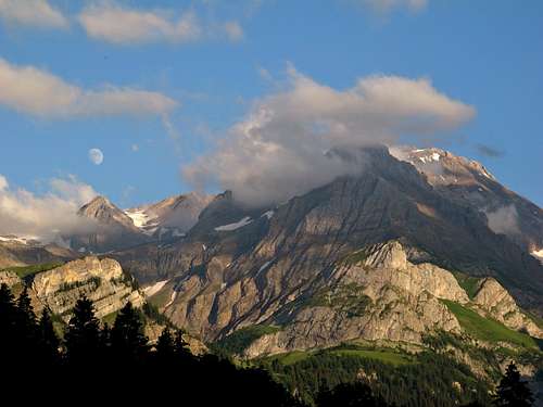 Moon above Chilchli; the summit of Wildhorn in cloud