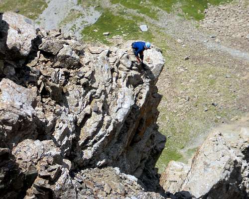 Looking for a way down. Descending the west face is NOT advisable.
