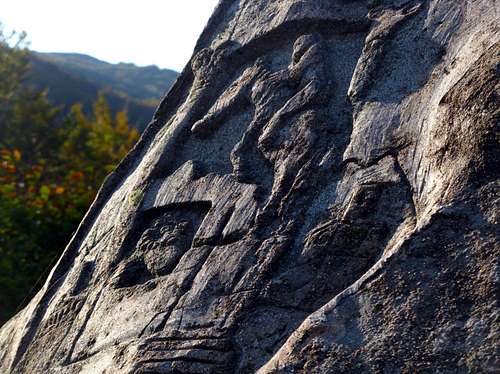 An ancient stone's bas-relief nearby Badignana Huts