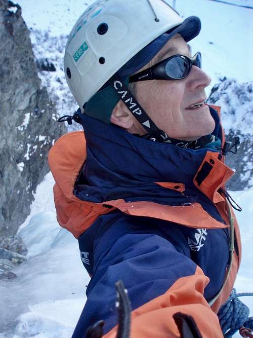 Ice climbing - Nigel at the hanging belay on Cascade de Bonatchiesse